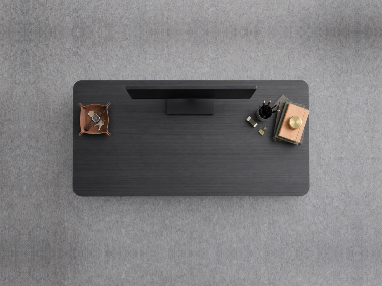 A JoyDesk desk topped in Black Laminate at 1200mm, seen from above