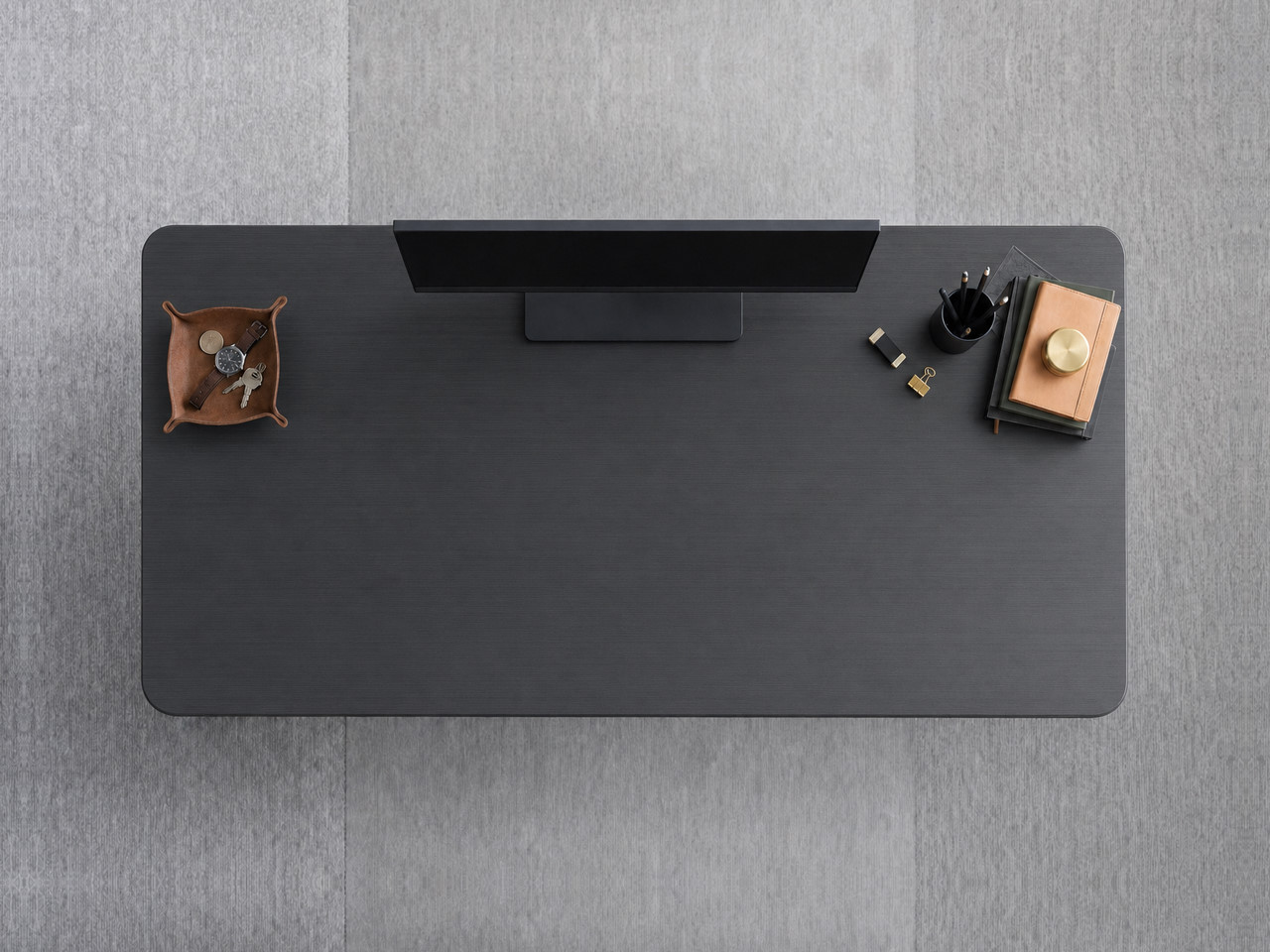 A JoyDesk desk topped in Black Laminate at 1500mm, seen from above