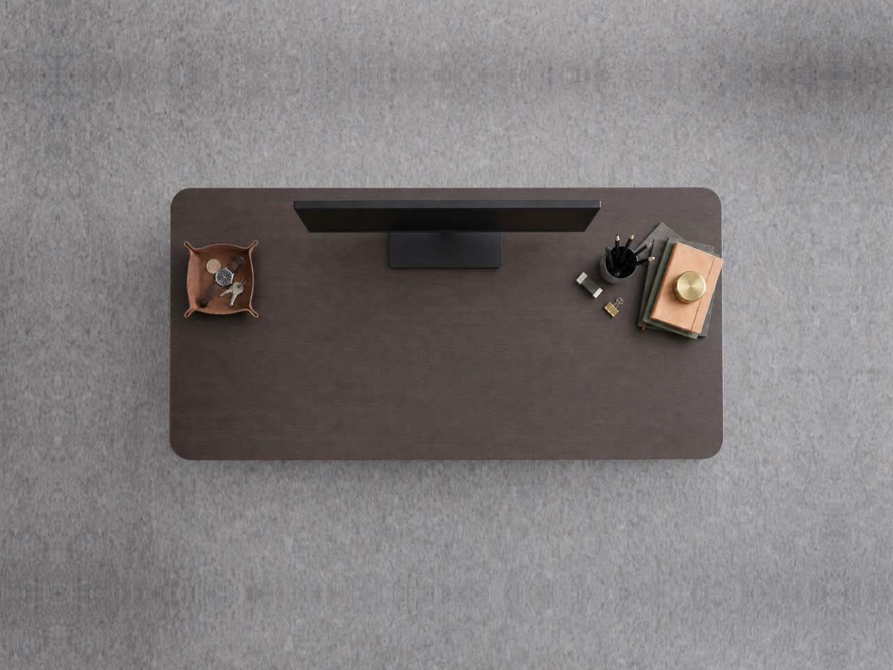A JoyDesk desk topped in Dark Walnut Laminate at 1200mm, seen from above