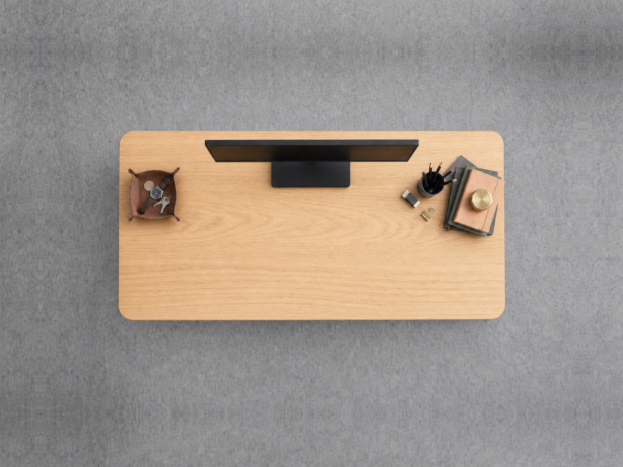 A JoyDesk desk topped in Light Oak Rubberwood at 1200mm, seen from above